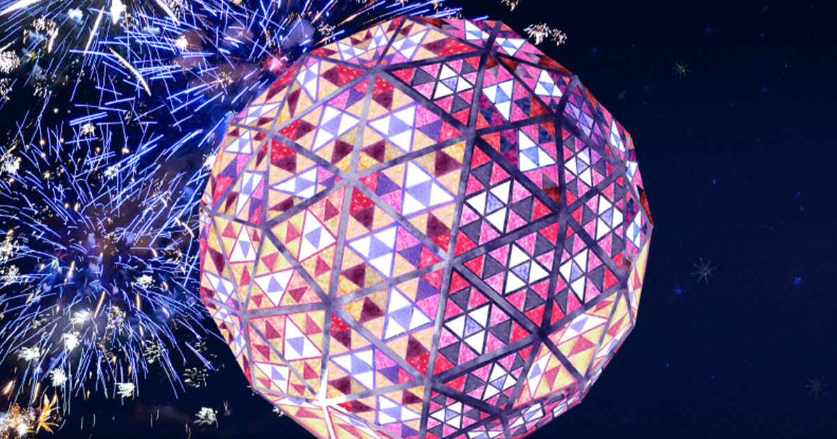 The Times Square New Year's Eve Ball sitting in front of fireworks on a night sky. Engineering the Times Square New Year’s Eve Ball Drop.